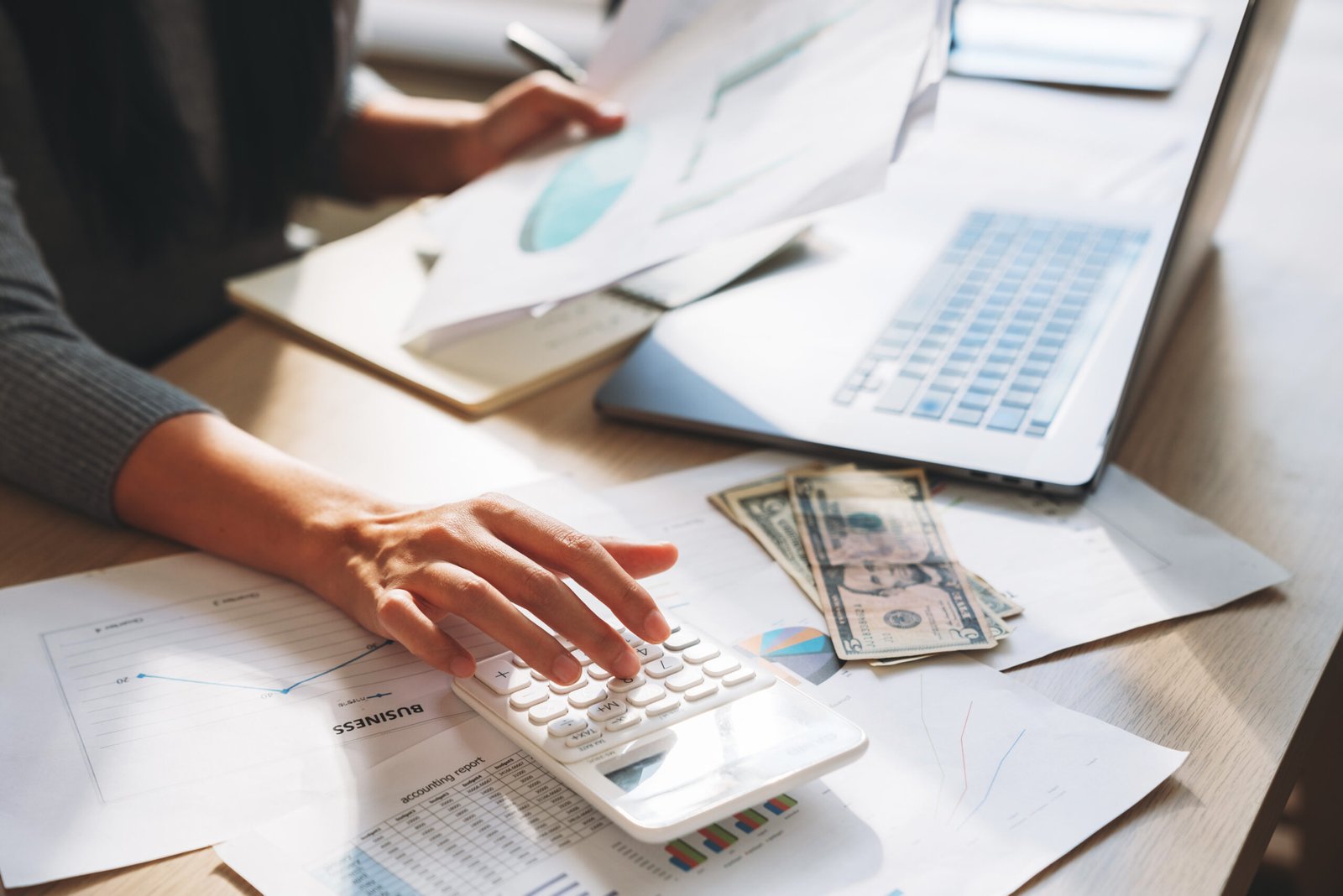 a-woman-is-working-on-a-laptop-and-a-calculator-on-2026-01-09-11-14-32-utc (1)