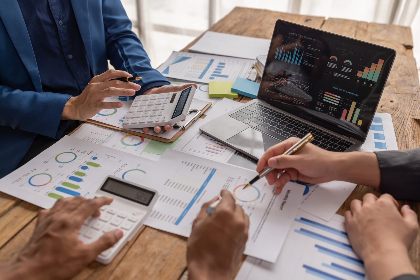 group-of-confident-business-people-point-to-graphs-2026-01-08-06-02-24-utc